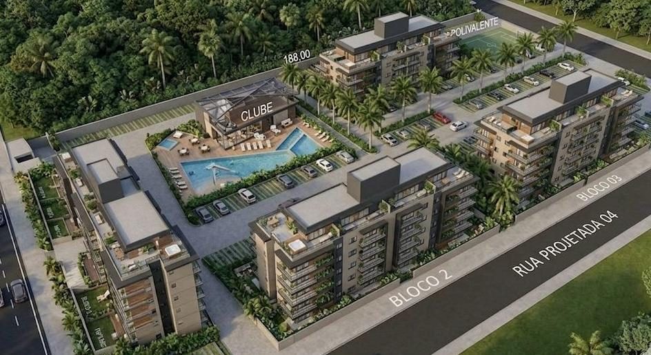 Perspectiva aérea de quatro blocos residenciais em volta de um clube com piscina